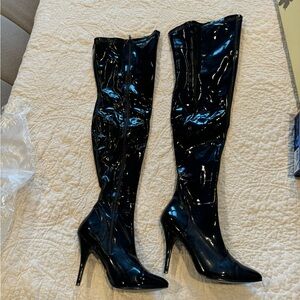Thigh high stiletto pleather zip up boots. Size 10.